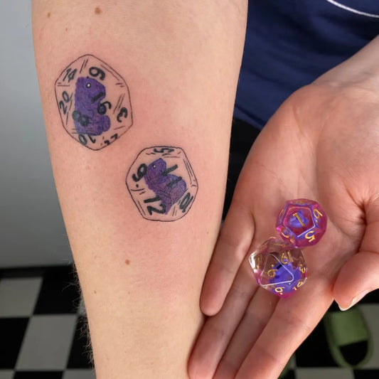 Small Illustrative Dice Tattoo on Women Arm by @mania.tatuatorka