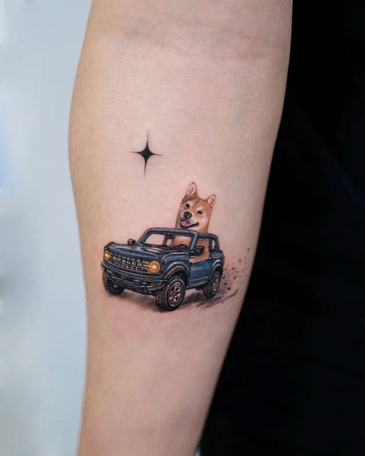 Small Illustrative Dog in Car Tattoo on Women Arm by @abbey.707ink