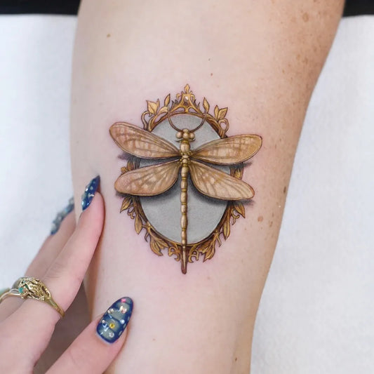 Small Illustrative Dragonfly Mirror Frame on Women Thigh Tattoo by @edit_paints