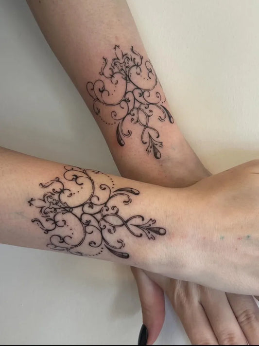 Small Illustrative Floral Vine Tattoo on Women Wrist by @earth.vessel
