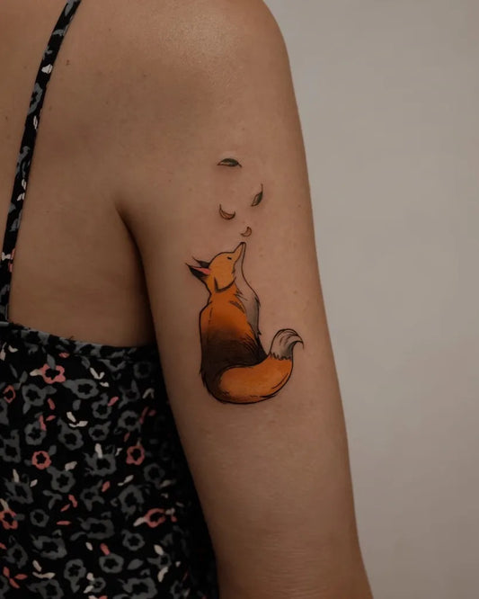 Small Illustrative Fox with Moon Tattoo on Women Upper Arm by @kylar_tattoo