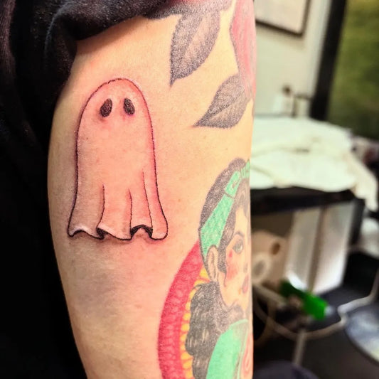 Small Illustrative Ghost Tattoo on Women Arm by @bearlegdesigns
