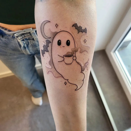 Small Illustrative Ghost with Coffee Tattoo on Women Arm by @doesnt.care.at.all