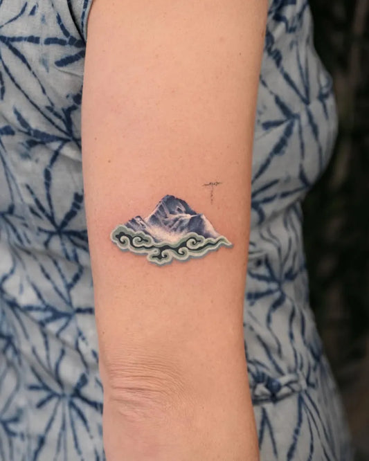 Small Illustrative Mountain Cloud Tattoo on Women Arm by @inktattoo_dirtok