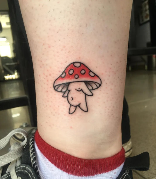 Small Illustrative Mushroom Bunny on Women Ankle Tattoo by @maisiecarter_tattoo