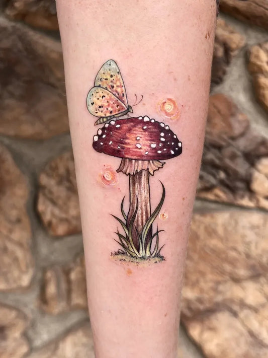 Small Illustrative Mushroom and Butterfly on Women Arm Tattoo by @lydia_tattoos