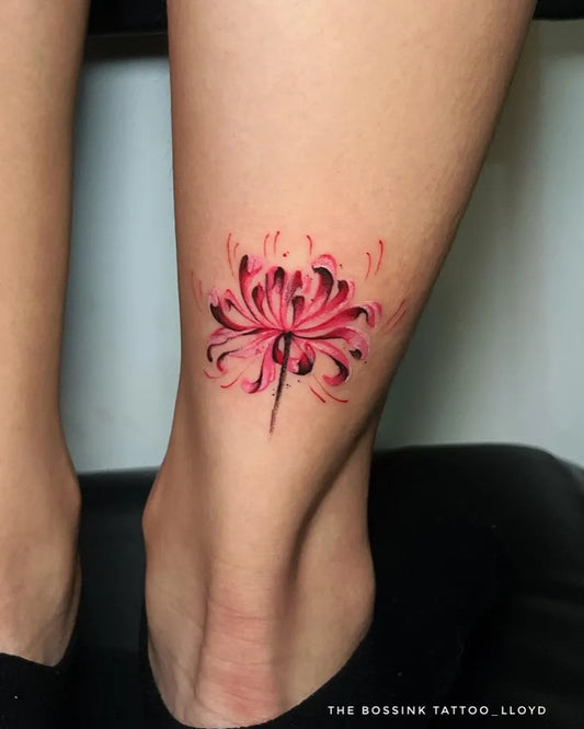 Small Illustrative Pink Spider Lily Tattoo on Women Leg by @thebossink.tattoo