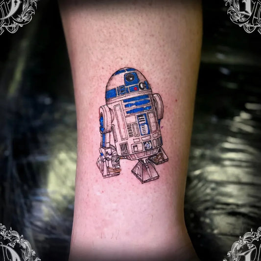 Small Illustrative R2D2 Droid Star Wars Tattoo on Women Ankle by @nerang_tattoo_mafia_aus