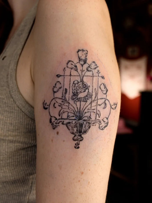 Small Illustrative Rose and Vines Tattoo on Women Arm by @creo.tattooo