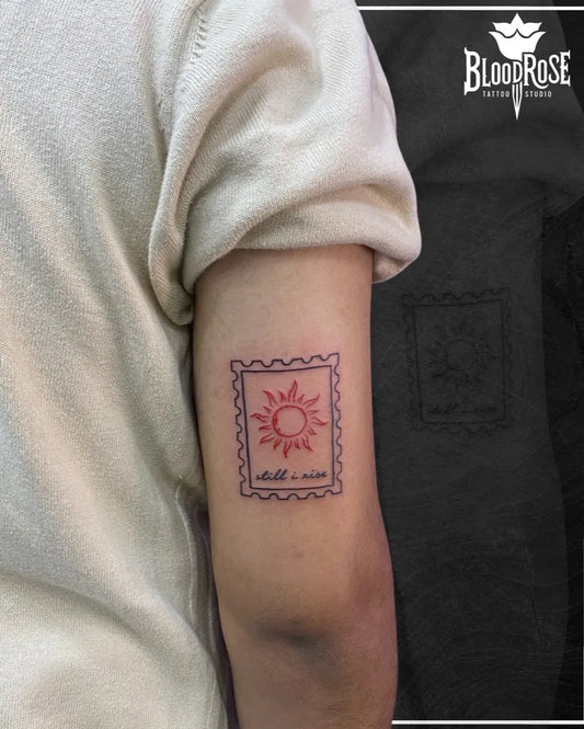 Small Illustrative Sun Stamp on Women Arm Tattoo by @bloodrosetattoostudio