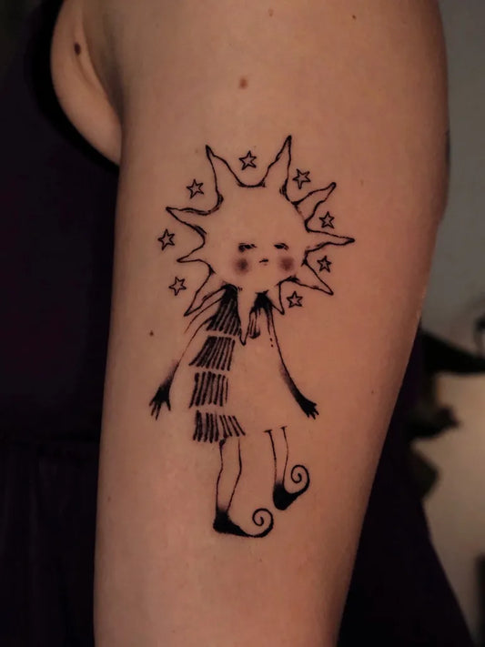 Small Illustrative Sunfaced Figure Tattoo on Women Arm by @sleepywoode