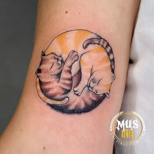 Small Illustrative Yin Yang Cats Tattoo on Women Arm by @musink