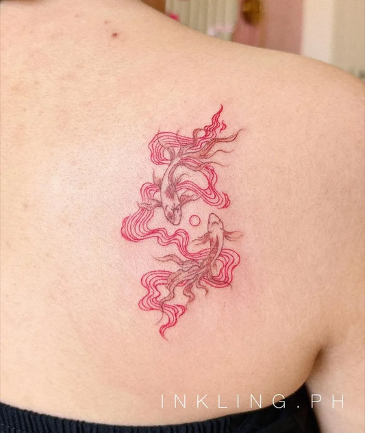 Small Illustrative Yin Yang Koi Pisces Tattoo on Women Shoulder by @inkling.ph