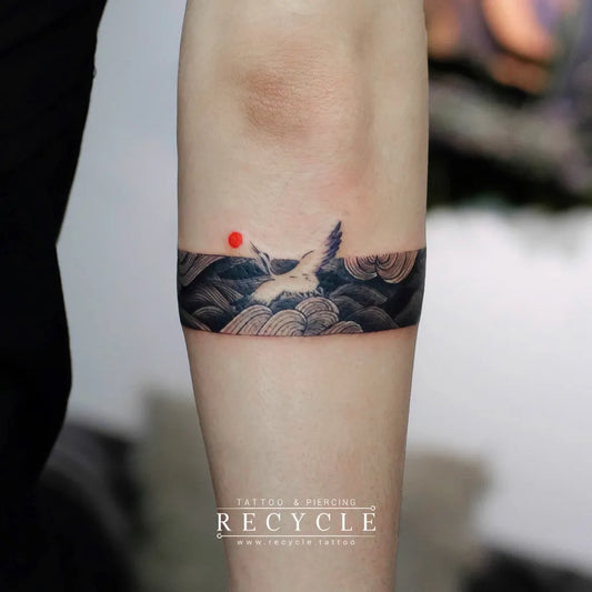 Small Irezumi Flamingo Waves Sun Tattoo on Women Arm by @recycle.tattoo