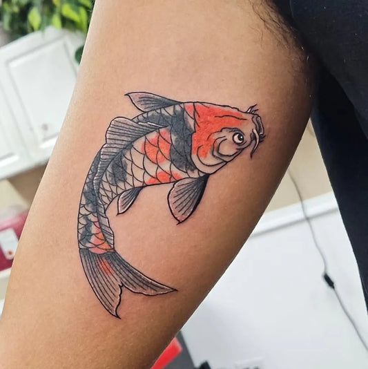 Small Irezumi Koi Fish Tattoo on Men Bicep by @kmotattoos