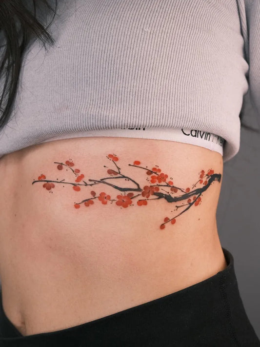 Small Japanese Cherry Blossom Branch on Women Rib Tattoo by @maobi.tattoo