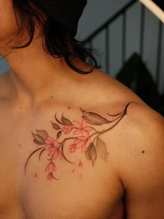 Small Japanese Cherry Blossom on Men Shoulder Tattoo by @lorietattoos