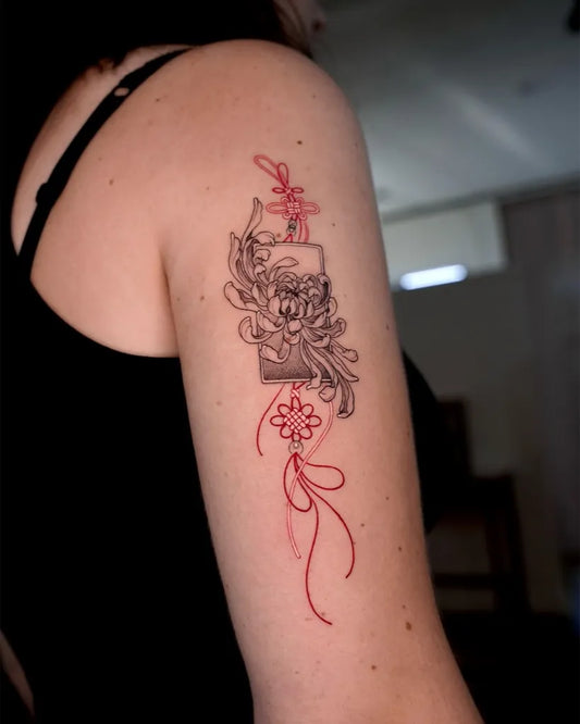 Small Japanese Chrysanthemum Red and Lantern Tattoo on Women Upper Arm by @hwana.tt