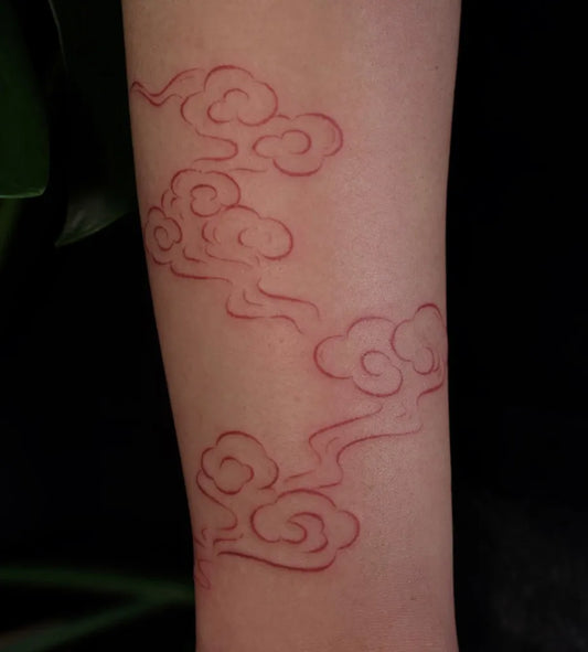 Small Japanese Cloud Tattoo on Women Arm by @baby.cleaver