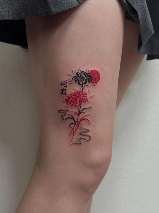 Small Japanese Red Spider Lily with Sun Tattoo on Women Thigh by @mie.ink91_tokyotattooartist