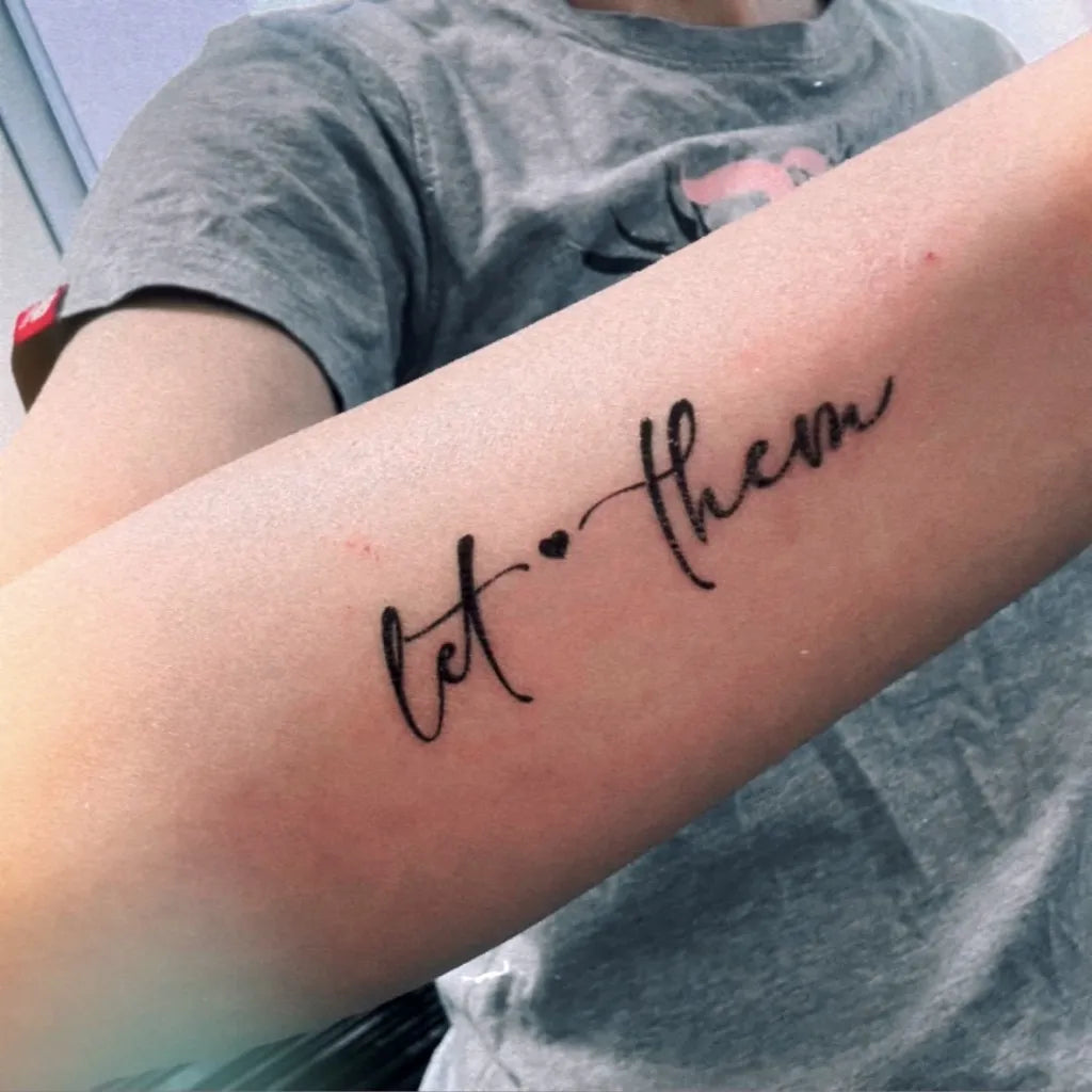 Let Them with heart temporary tattoo on women forearm