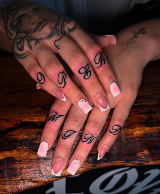 Small Letter Tattoos on Women Fingers Tattoo by @inkedby.ak