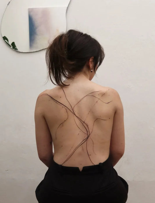 Small Linework Abstract Lines on Women Back Tattoo by @filll.ink