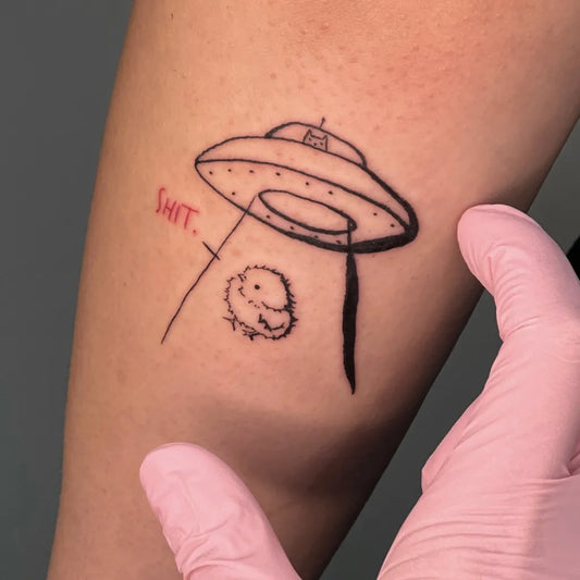 Small Linework Alien UFO Chick Tattoo on Women Arm by @nastia.sticht.zu