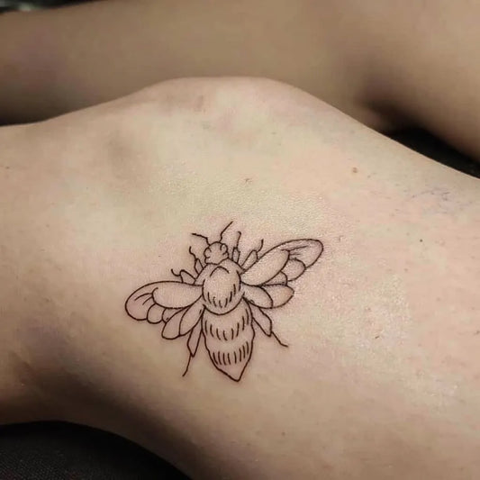 Small Linework Bee on Women Knee Tattoo by @legacy_studios.6000