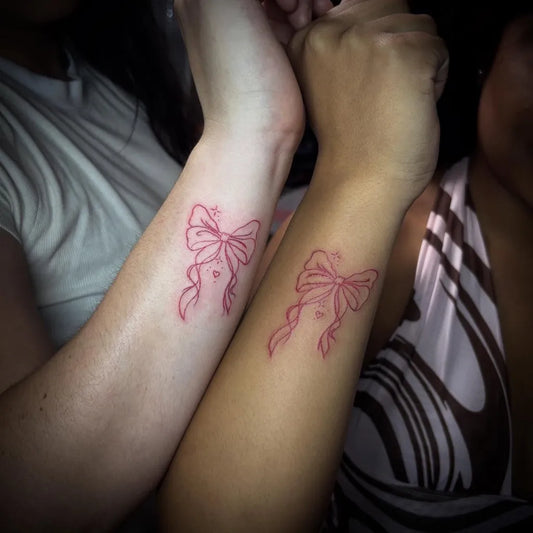 Small Linework Bow on Friends Wrist Matching Tattoo by @tattoosby.jadance