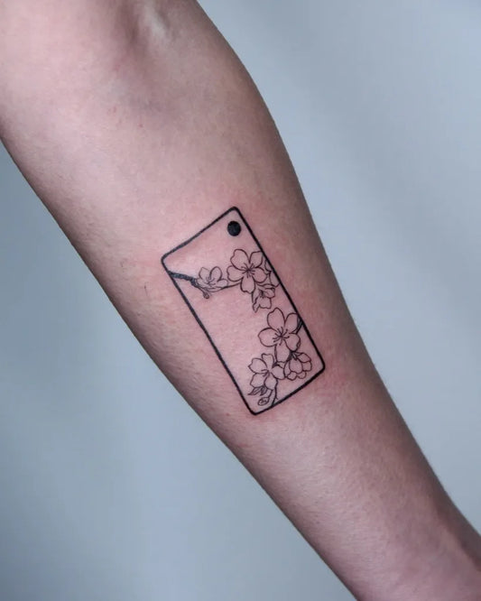 Small Linework Cherry Blossom in Frame on Women Arm Tattoo by @aeyetat