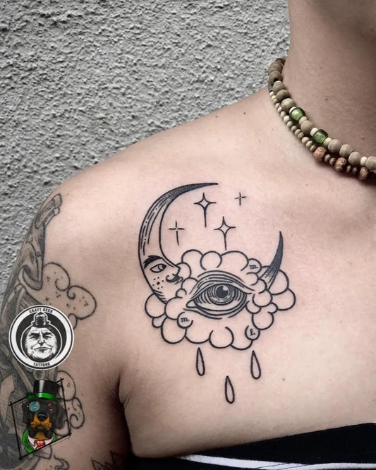Small Linework Crescent Moon Eye Cloud Tattoo on Women Shoulder by @kimboisadog