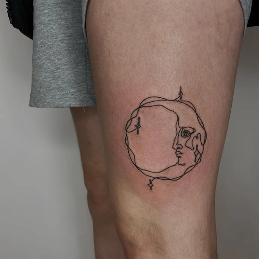 Small Linework Crescent Moon Face Tattoo on Women Thigh by @bitchpokes