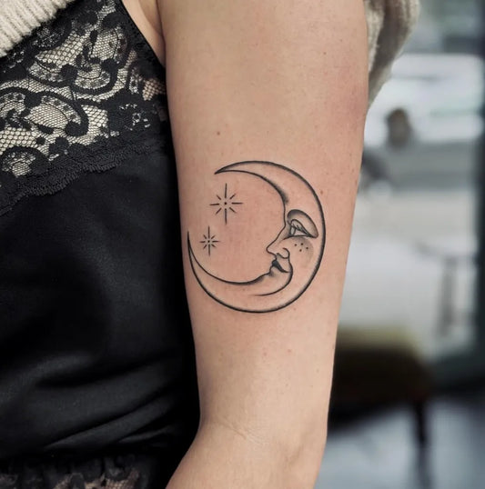 Small Linework Crescent Moon with Stars Tattoo on Women Arm by @nawojkatattoo