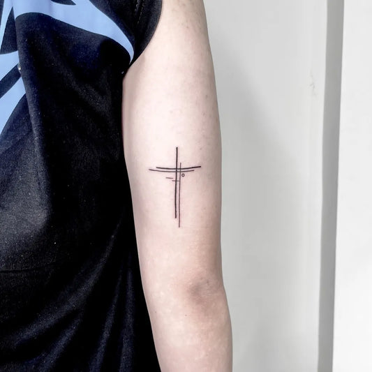 Small Linework Cross on Men Arm Tattoo by @tirta_arutalatattoo