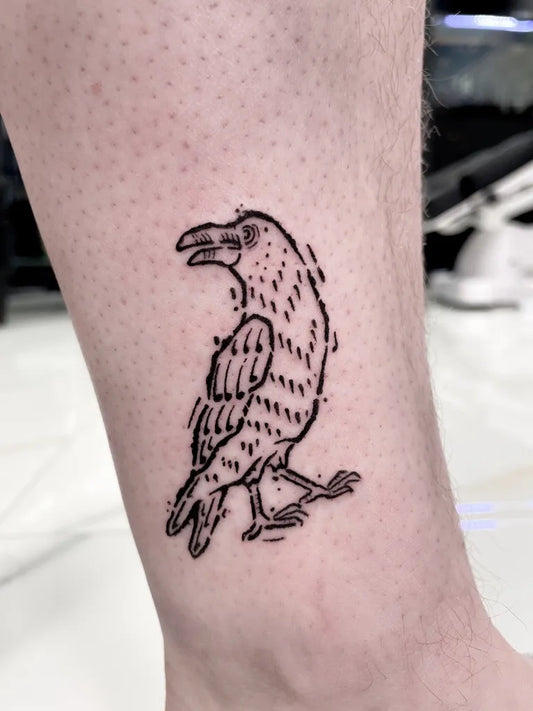 Small Linework Crow Tattoo on Men Leg by @everguild.ink