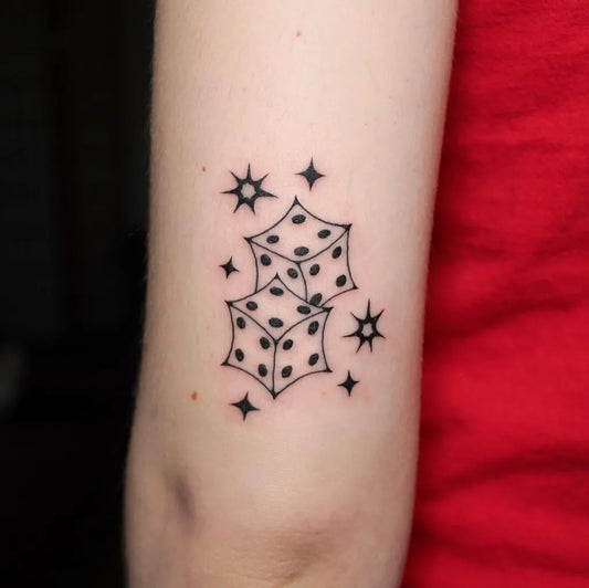Small Linework Dice and Stars on Women Arm Tattoo by @midnight__mastermind