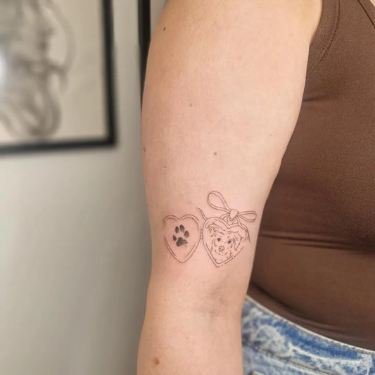 Small Linework Dog Heart Paw Tattoo on Women Arm by @tp.tattoos