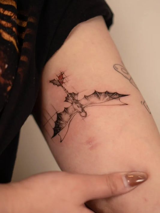 Small Linework Dragon on Women Arm Tattoo by @bona_ttoo