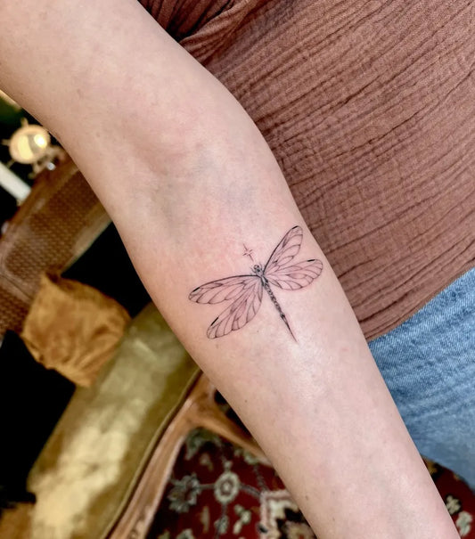 Small Linework Dragonfly on Women Arm Tattoo by @bee.ophilia.art