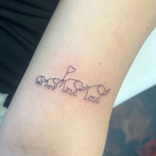 Small Linework Elephant Family Tattoo on Women Arm by @nails_by_petra_hemel