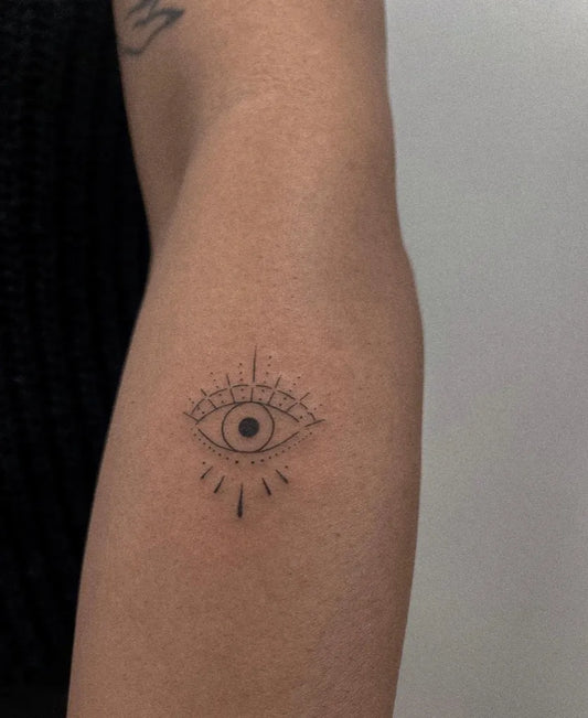 Small Linework Eye with Rays on Women Arm Tattoo by @alina.tattoo.ink