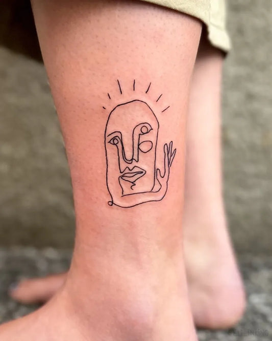 Small Linework Face Tattoo on Women Ankle by @eli_inking
