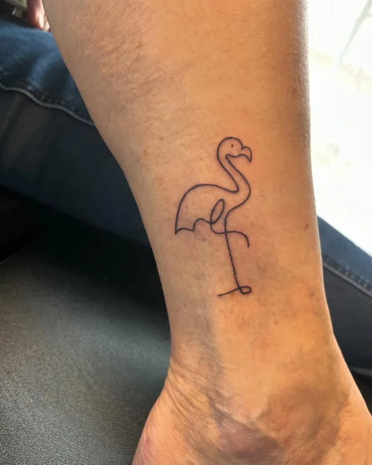 Small Linework Flamingo Tattoo on Women Ankle by @hmtattstudio