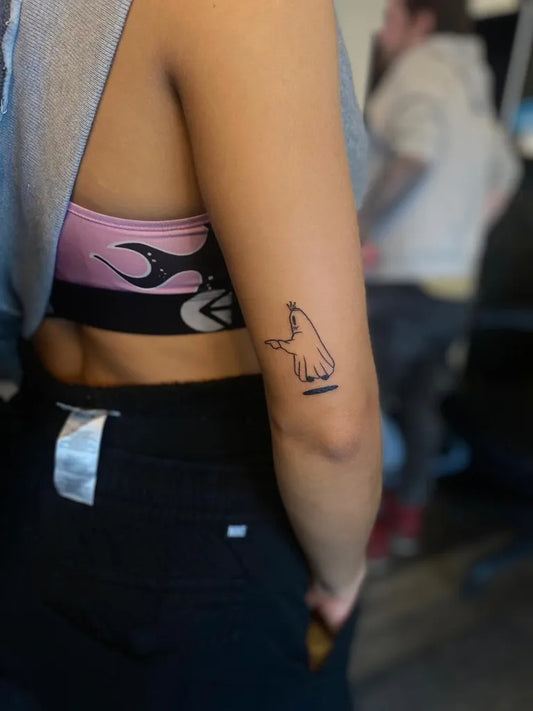 Small Linework Ghost Hand Tattoo on Women Arm by @burnedheartstattoos