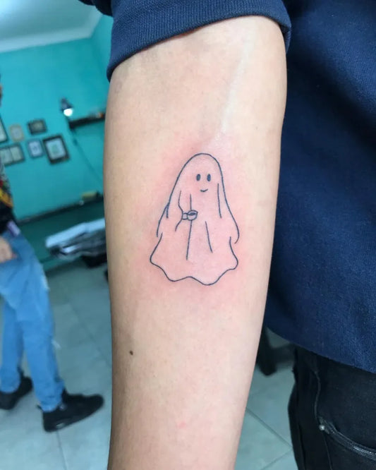 Small Linework Ghost Tattoo on Men Arm by @tradicion_tattoosc