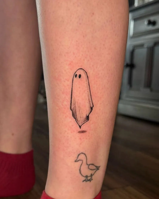 Small Linework Ghost and Duck Tattoo on Women Leg by @donyill