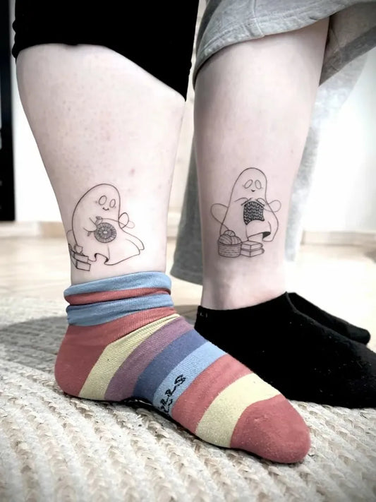 Small Linework Ghost with Cup on Couple Legs Matching Tattoo by @sutattoosd