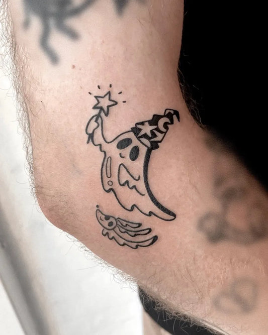 Small Linework Ghost with Wand and Bat Tattoo on Men Arm by @lana_here_tattoo