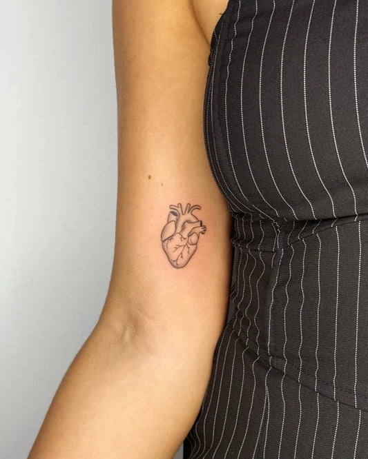 Small Linework Heart on Women Arm Tattoo by @lenne.sarah.tattoo